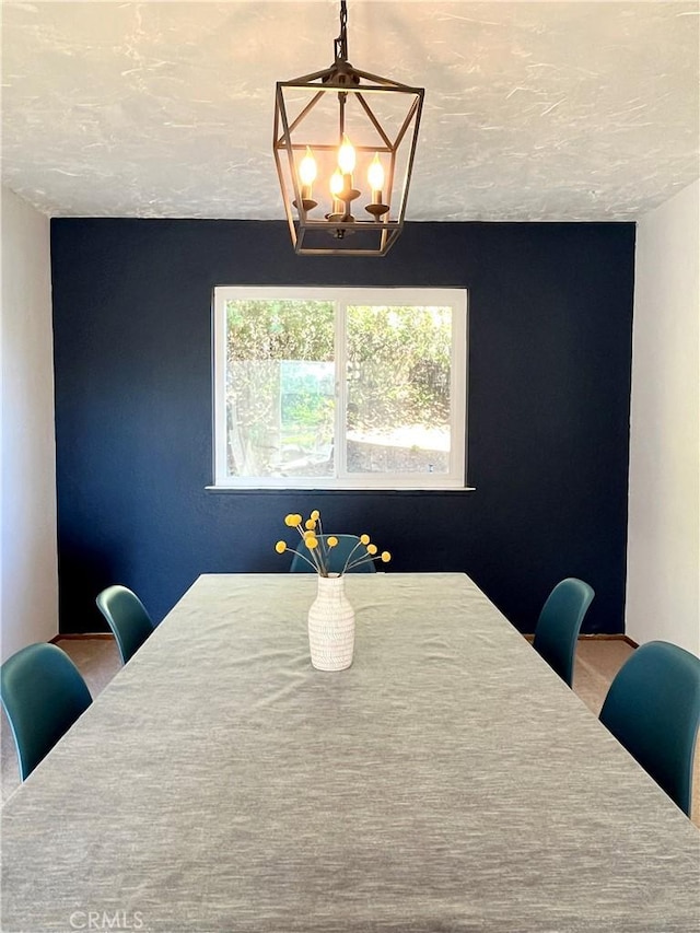 dining space featuring a notable chandelier