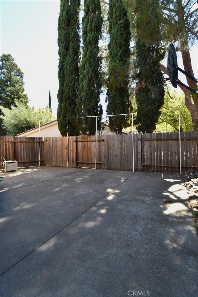 view of patio / terrace featuring fence