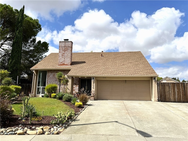 view of front of house with a front lawn and a garage