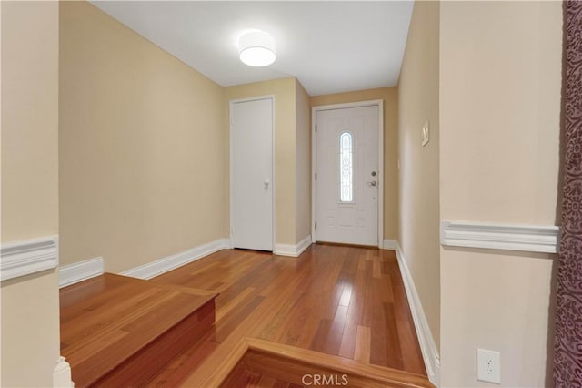 foyer entrance with hardwood / wood-style flooring