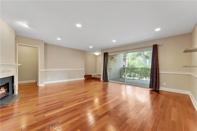 unfurnished living room featuring light wood-type flooring