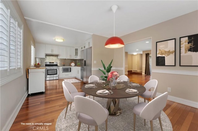 dining room with wood-type flooring