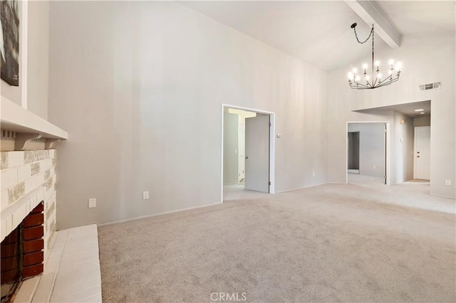 unfurnished living room with beamed ceiling, high vaulted ceiling, a chandelier, and a fireplace