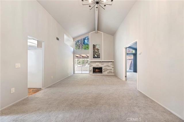 unfurnished living room with high vaulted ceiling, light carpet, a fireplace, and beam ceiling