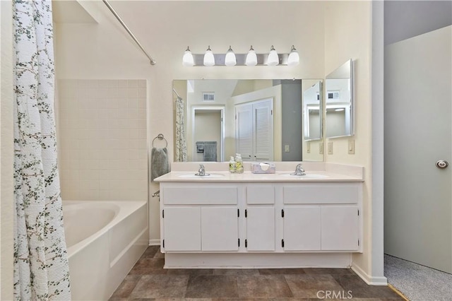 bathroom featuring shower / bath combination with curtain and vanity