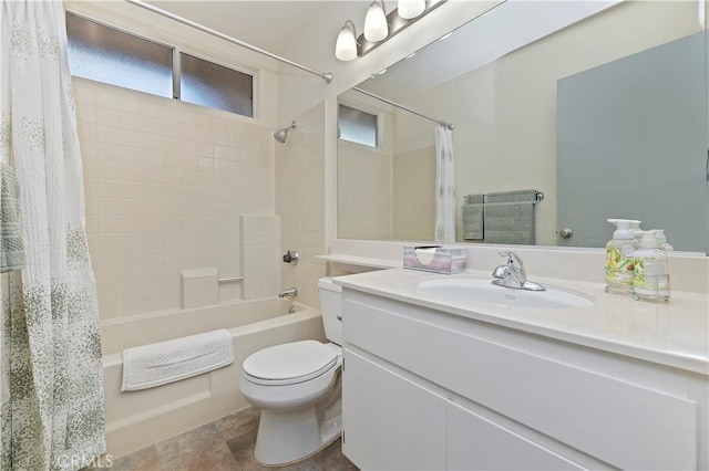 full bathroom with shower / bathtub combination with curtain, vanity, and toilet