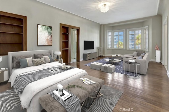 bedroom featuring a chandelier, radiator heating unit, and dark wood-type flooring