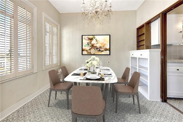 dining space featuring a notable chandelier