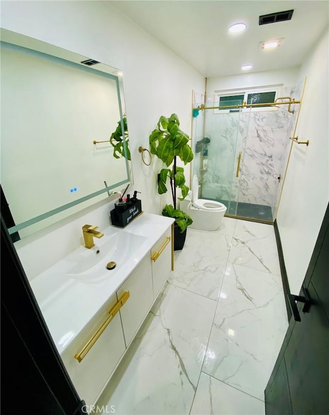 bathroom featuring vanity, toilet, and a shower with shower door