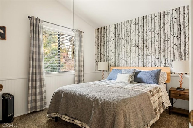 carpeted bedroom with wood walls and lofted ceiling