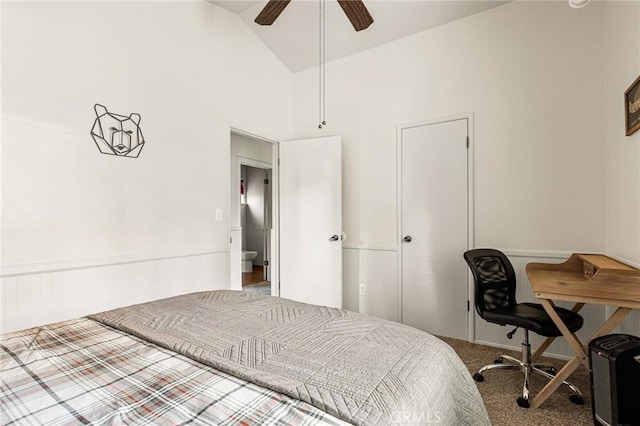 carpeted bedroom with ceiling fan and high vaulted ceiling