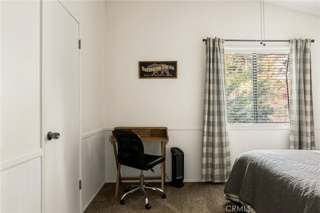 carpeted bedroom with vaulted ceiling