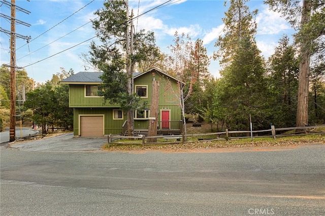 view of front of property with a garage