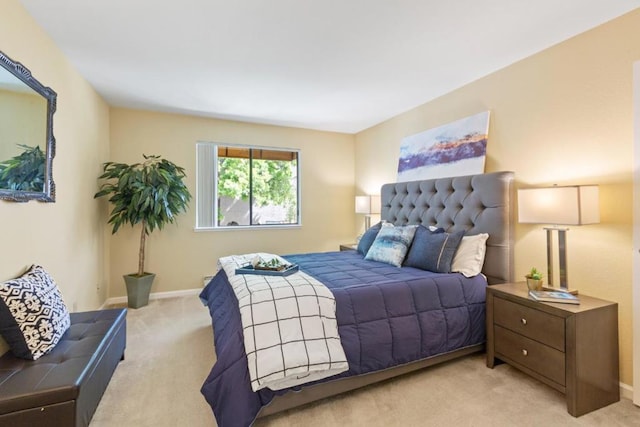 bedroom with light colored carpet