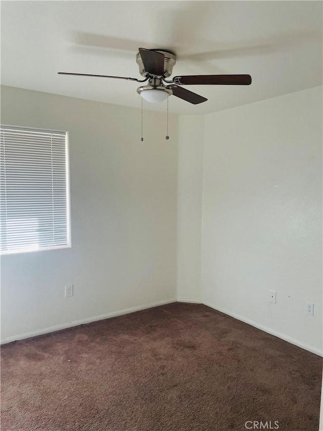 unfurnished room featuring carpet and ceiling fan