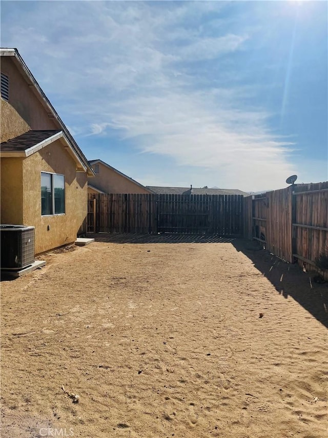 view of yard featuring central AC unit