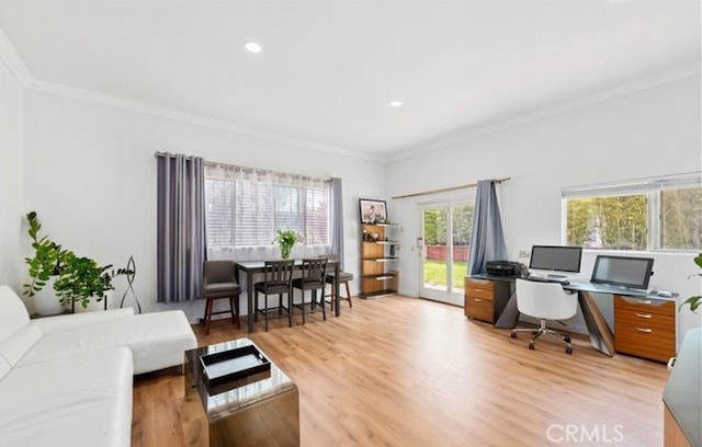 office area with light hardwood / wood-style flooring and ornamental molding