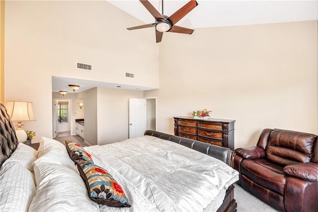 bedroom featuring high vaulted ceiling, ceiling fan, light colored carpet, and connected bathroom