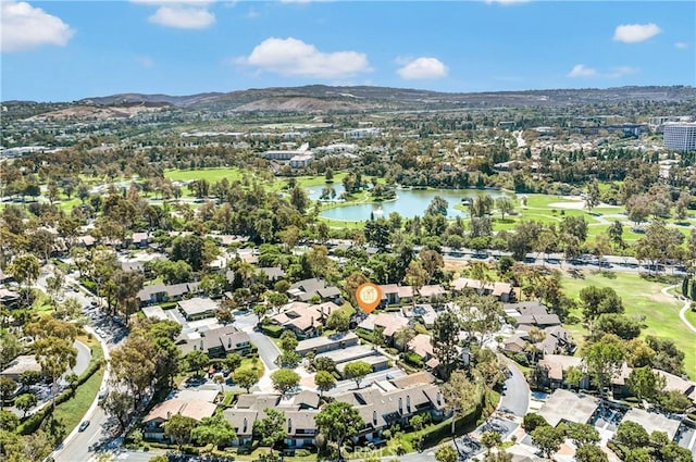 drone / aerial view with a water and mountain view