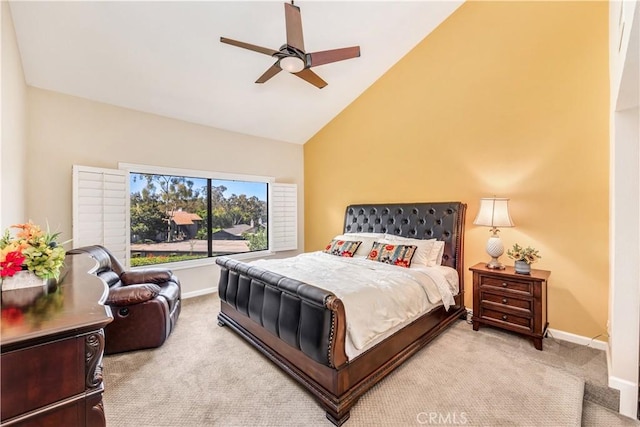 bedroom featuring ceiling fan, light colored carpet, and high vaulted ceiling