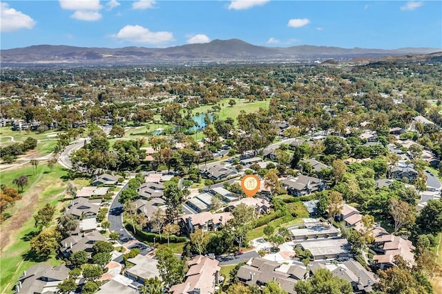 birds eye view of property with a mountain view