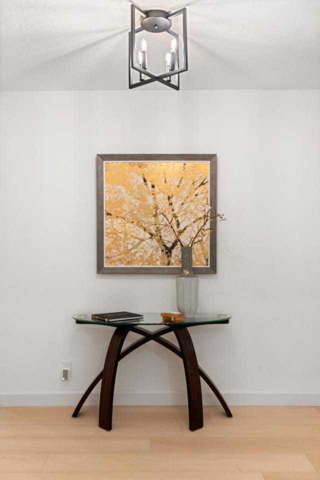 room details featuring hardwood / wood-style flooring and a notable chandelier