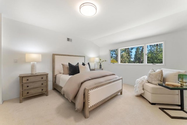 bedroom featuring vaulted ceiling and light carpet