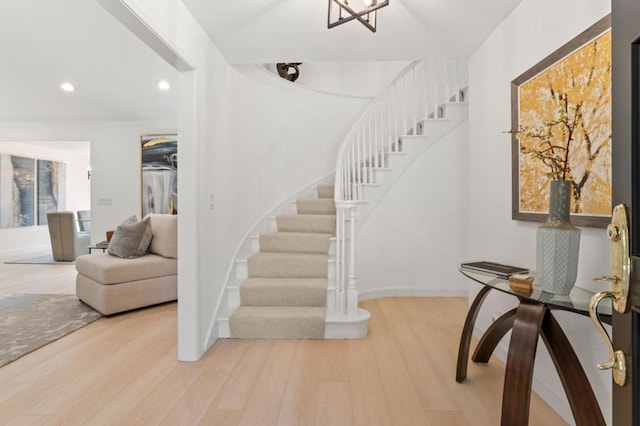 stairs with hardwood / wood-style floors