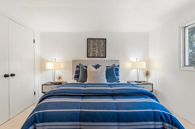 carpeted bedroom featuring a closet