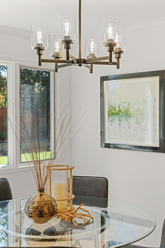 dining area featuring crown molding