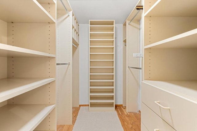 walk in closet featuring light hardwood / wood-style floors