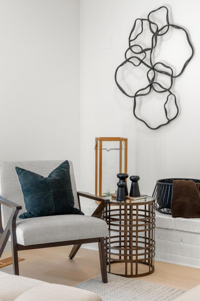 living area with hardwood / wood-style flooring