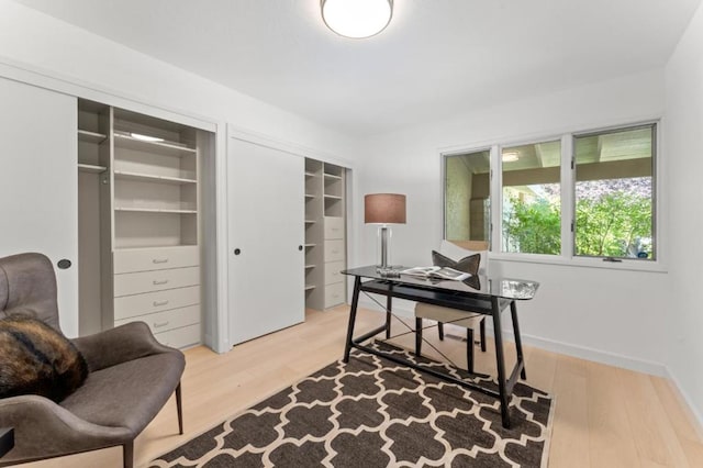 office area with light hardwood / wood-style flooring