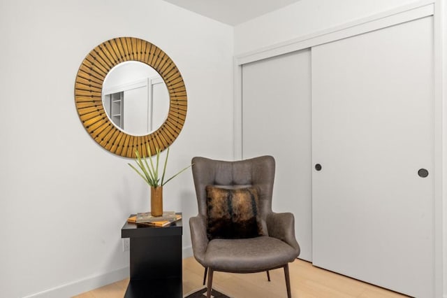 sitting room with light hardwood / wood-style flooring