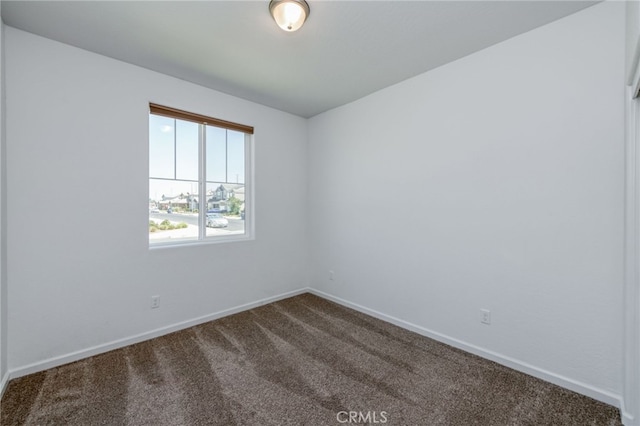 unfurnished room featuring carpet