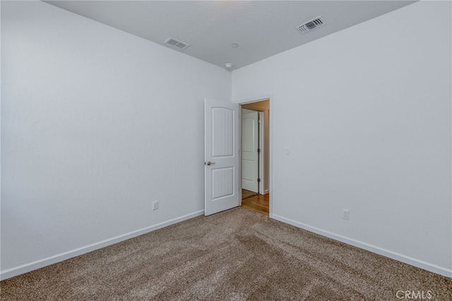 empty room featuring carpet flooring