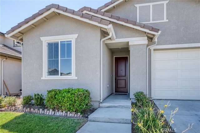 doorway to property featuring a garage