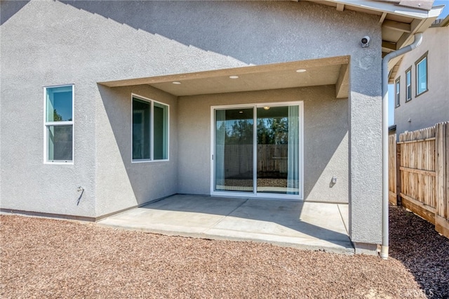 rear view of property featuring a patio