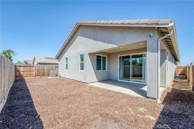 back of house featuring a patio and central air condition unit