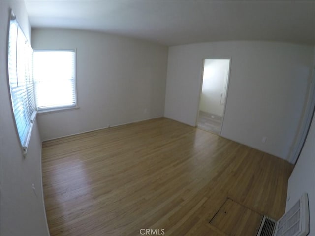 unfurnished room featuring light wood-type flooring