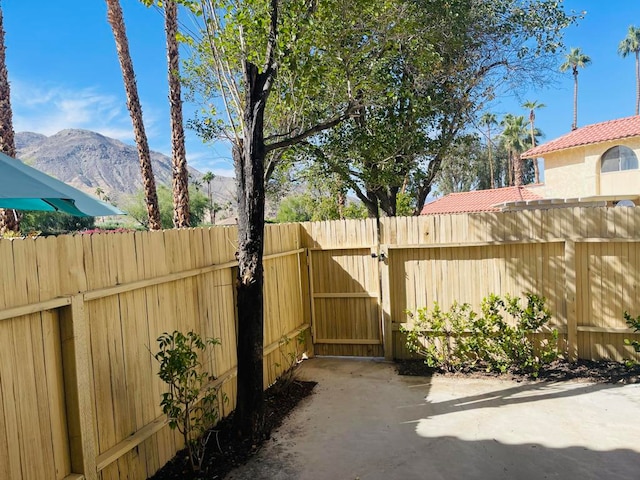 view of patio / terrace with a mountain view