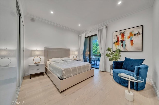 bedroom featuring access to exterior, ornamental molding, and light hardwood / wood-style flooring