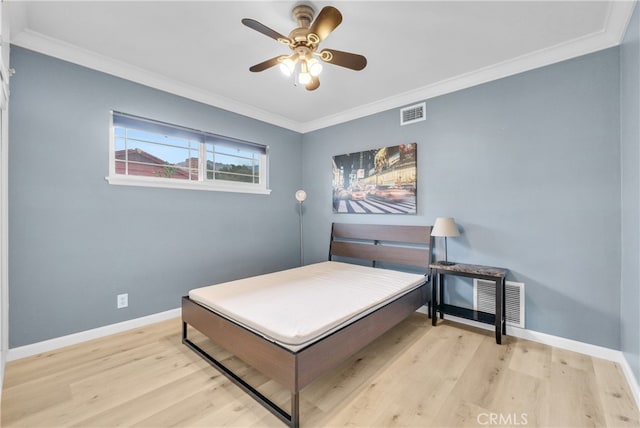 bedroom featuring ceiling fan, light hardwood / wood-style floors, and ornamental molding