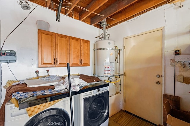 laundry area featuring cabinets, washer and dryer, and secured water heater