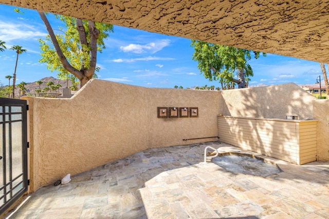 view of patio / terrace with a mountain view