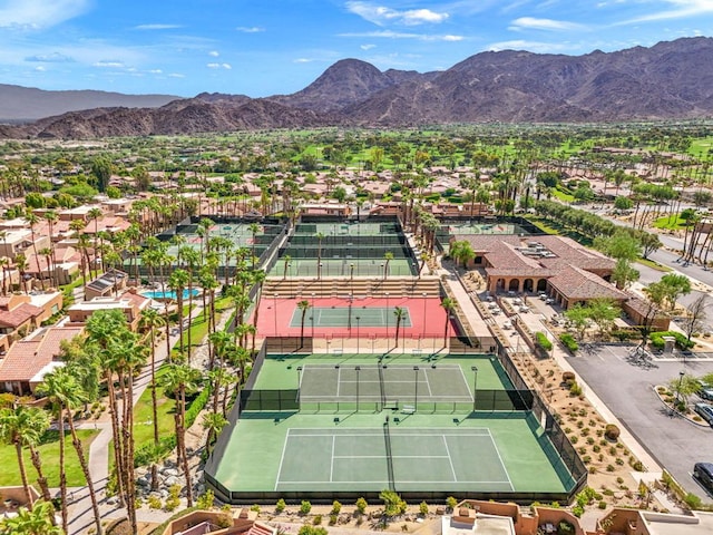 birds eye view of property with a mountain view