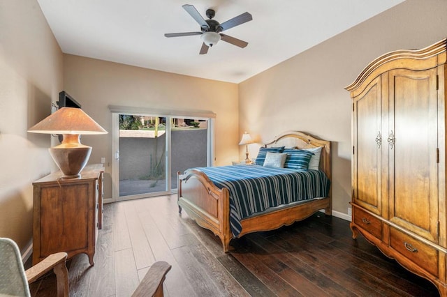 bedroom with dark wood-type flooring, access to outside, and ceiling fan