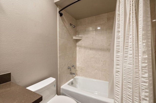 bathroom with shower / bath combination with curtain and toilet