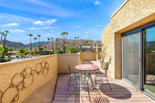 balcony featuring a mountain view