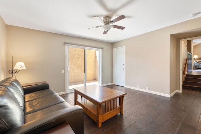 living room with dark hardwood / wood-style floors and ceiling fan